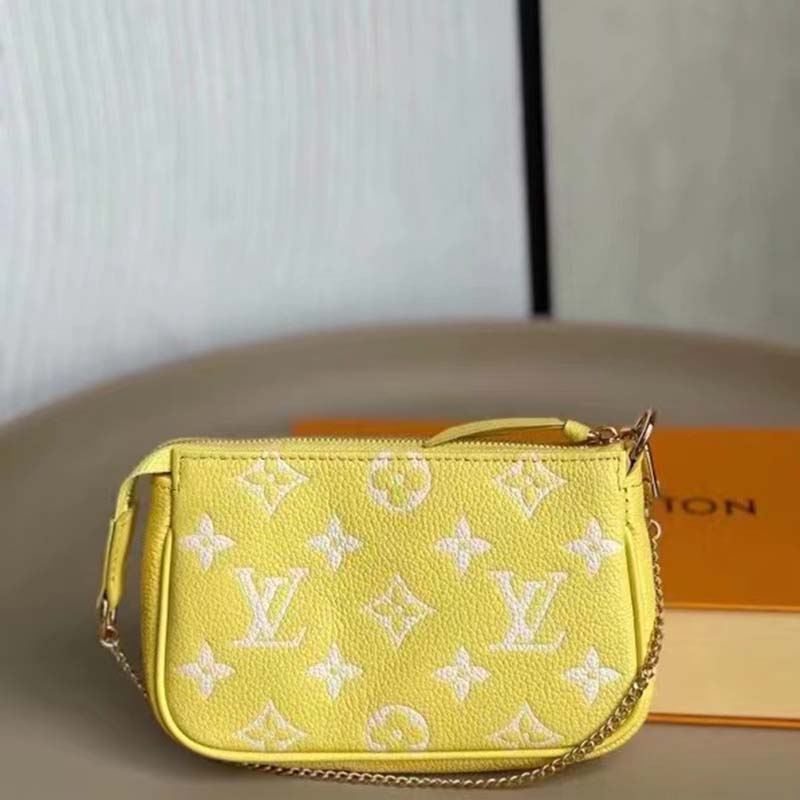 Louis Vuitton LV Women Mini Pochette Accessoires Yellow Monogram Empreinte Embossed Supple Grained Cowhide Clutch