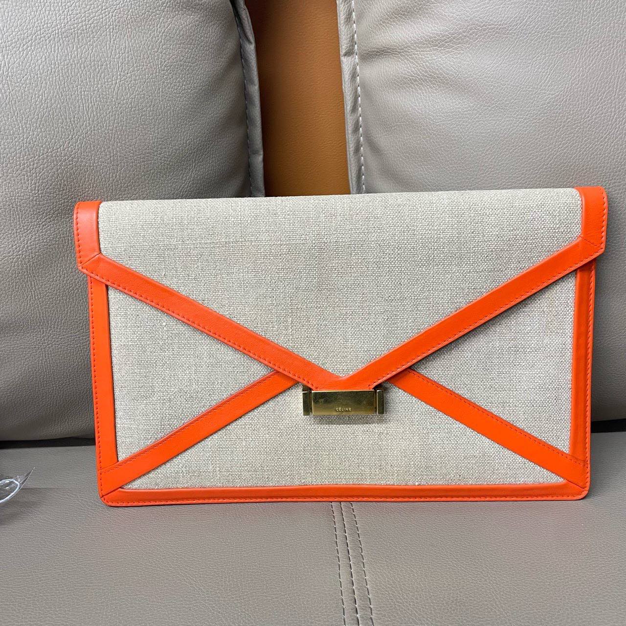 New Luxury CELINE Clutch in Orange Canvas