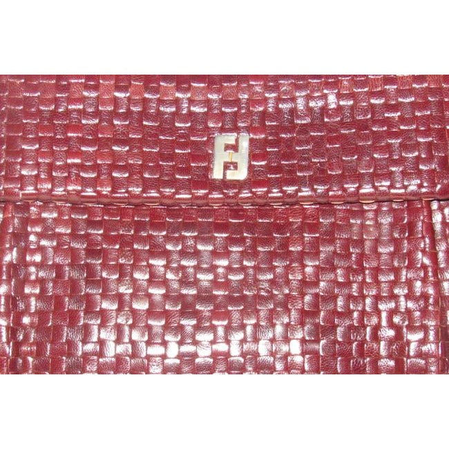 Fendi Purses Brown Woven Leather With A Leather Strap Handle In The Back Clutch