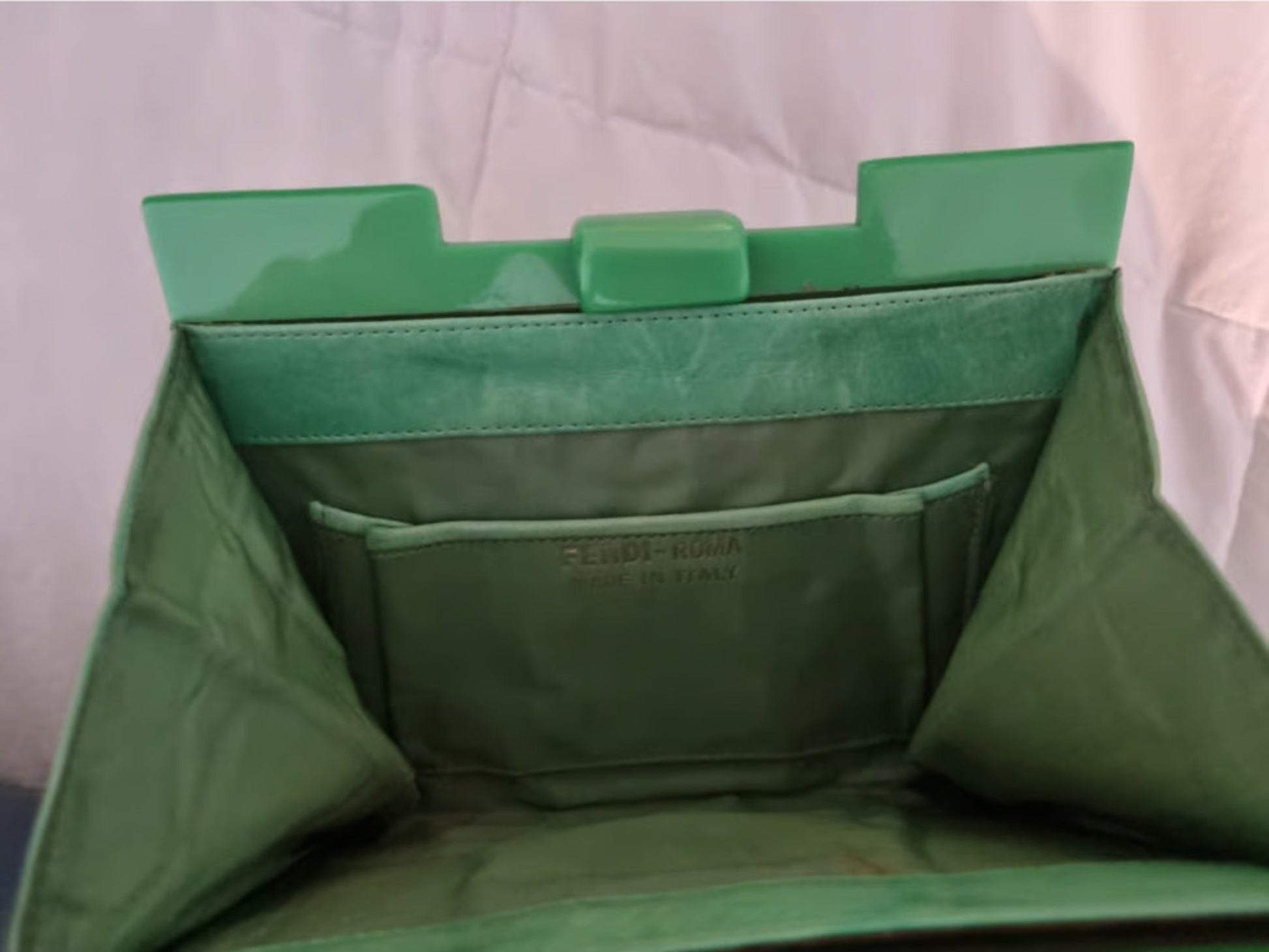 Fendi green clutch style purse made of Lucite tiles and green leather with a latch top closure
