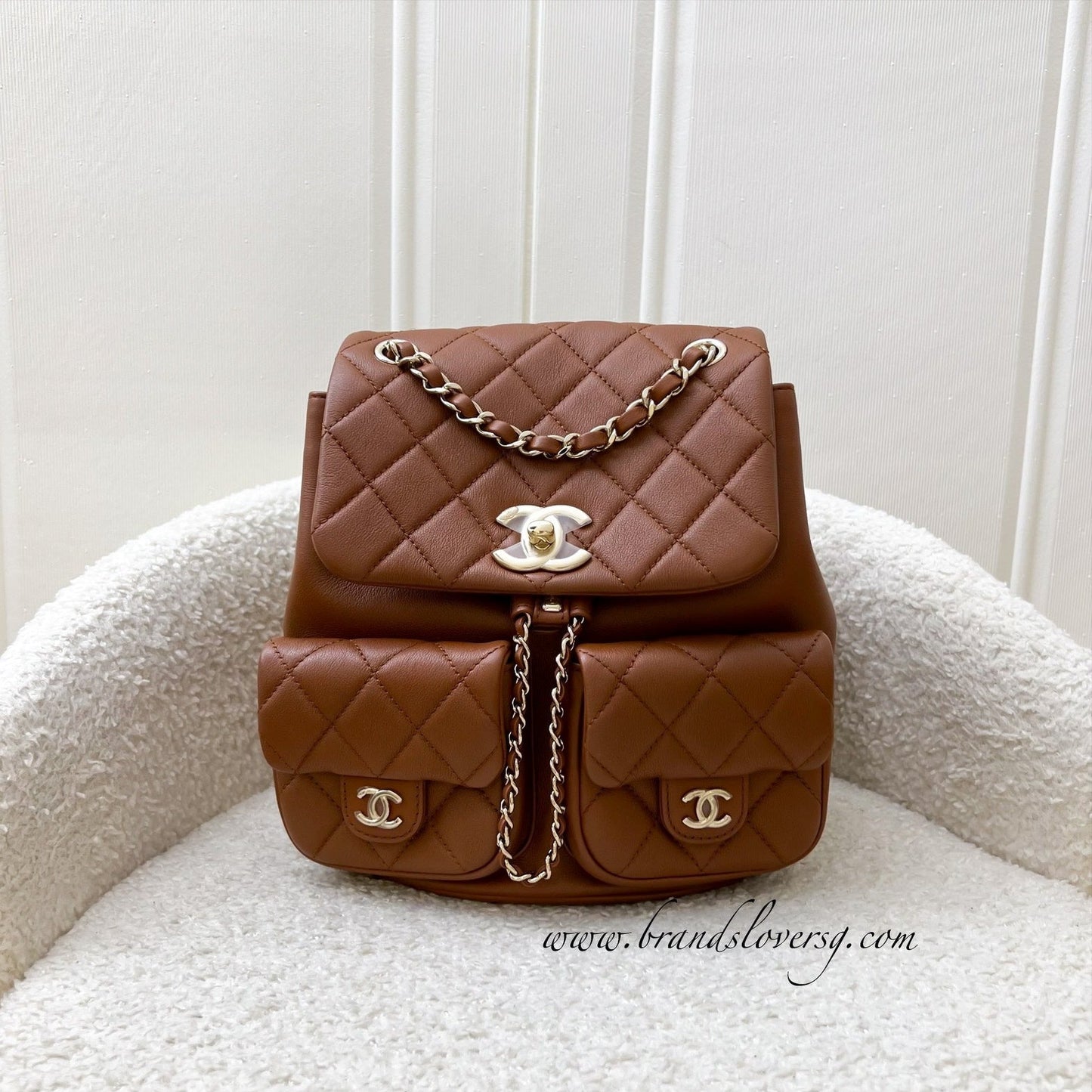 Chanel Medium Triple Backpack in 23A Cognac Brown Calfskin and LGHW (Model: AS3860)