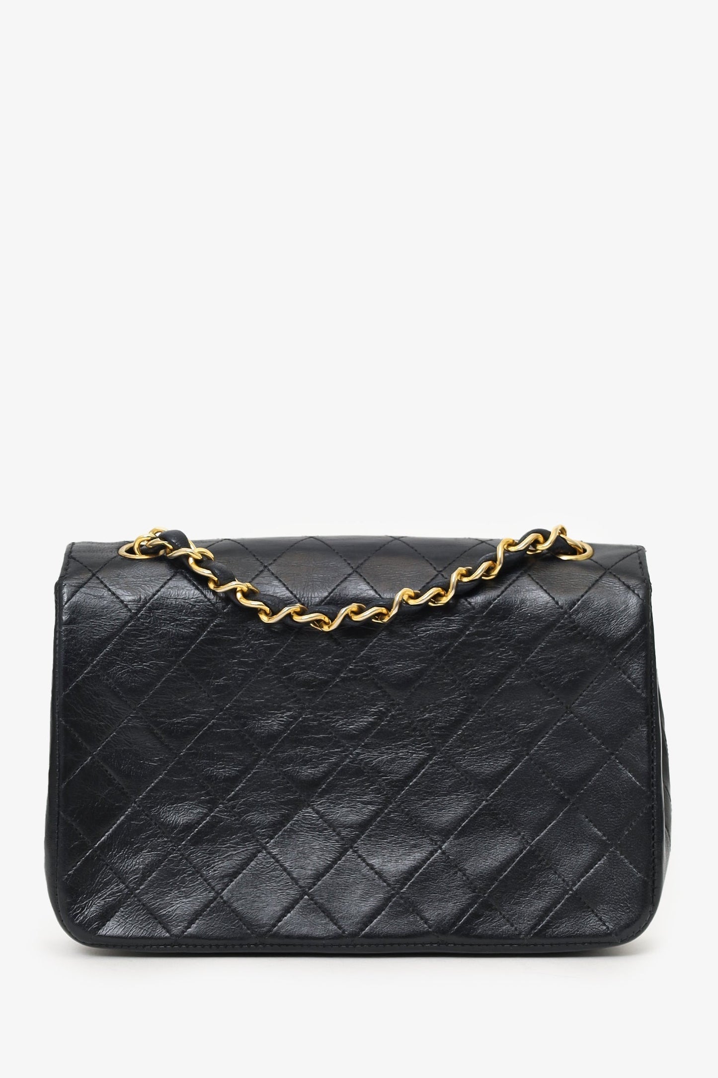 Chanel™ 1986-88 Black Quilted Lambskin Circle CC Mini Flap Bag