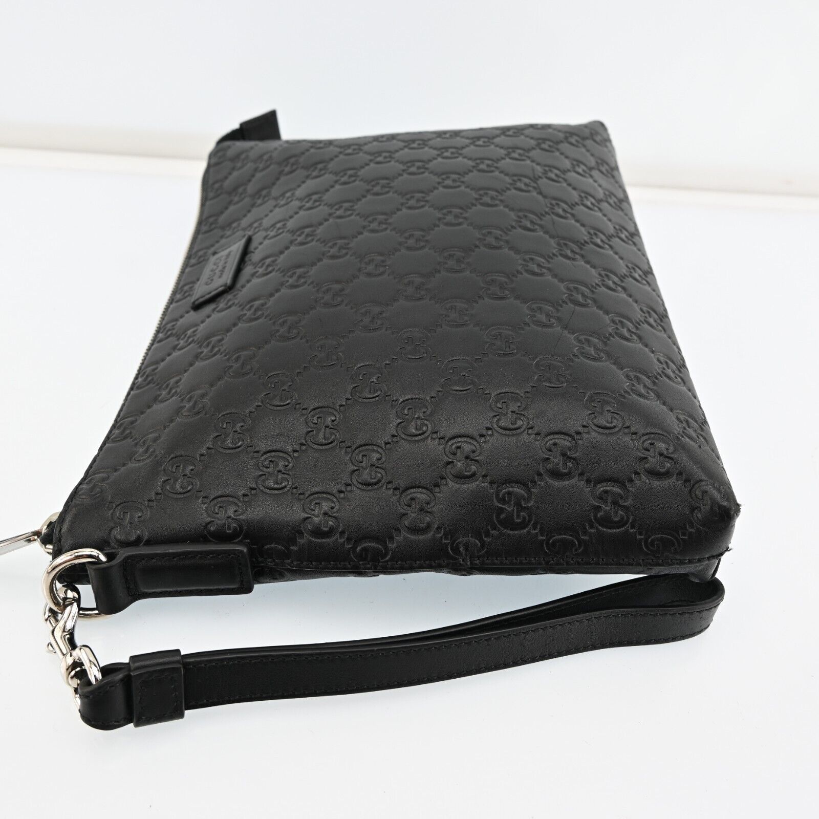 Gucci Monogram Leather Clutch