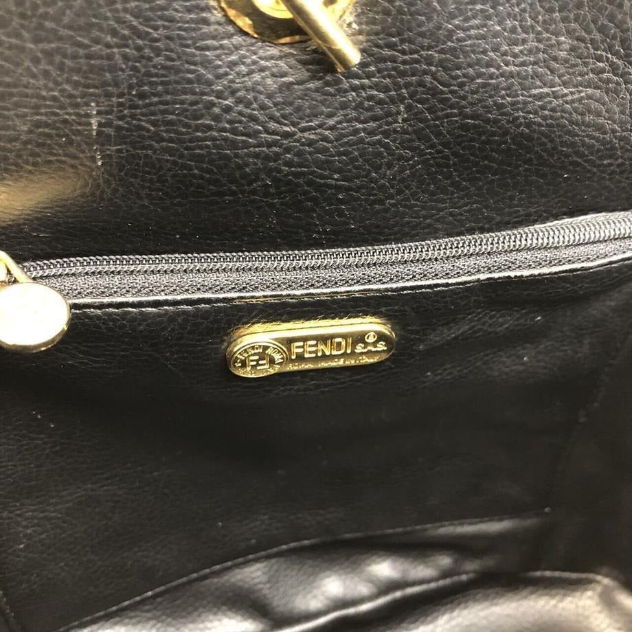 Fendi, black quilted suede with a 'pasta' or ' ' design, two way, sling style- clutch or cross body bag with gold 'pasta' accent beads